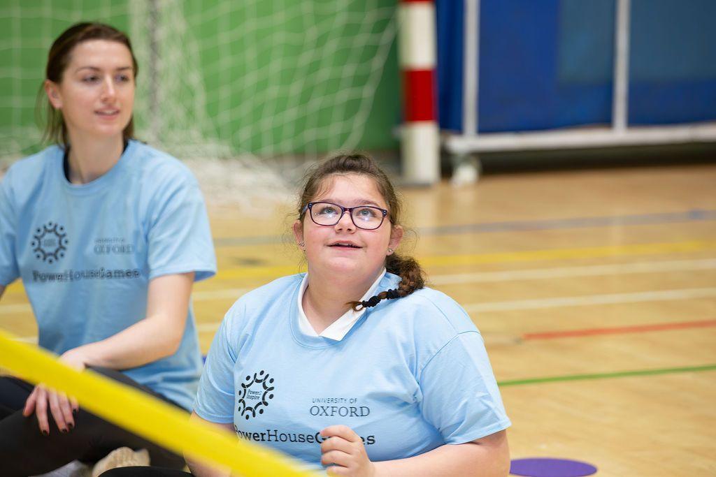 Girl and student sitting playing a game