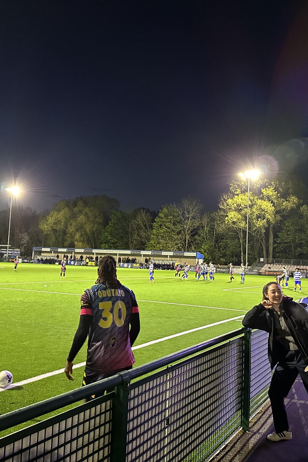 Fellows Isabelle Haynes and Mathilde Ritman watching game at Oxford City Football Club