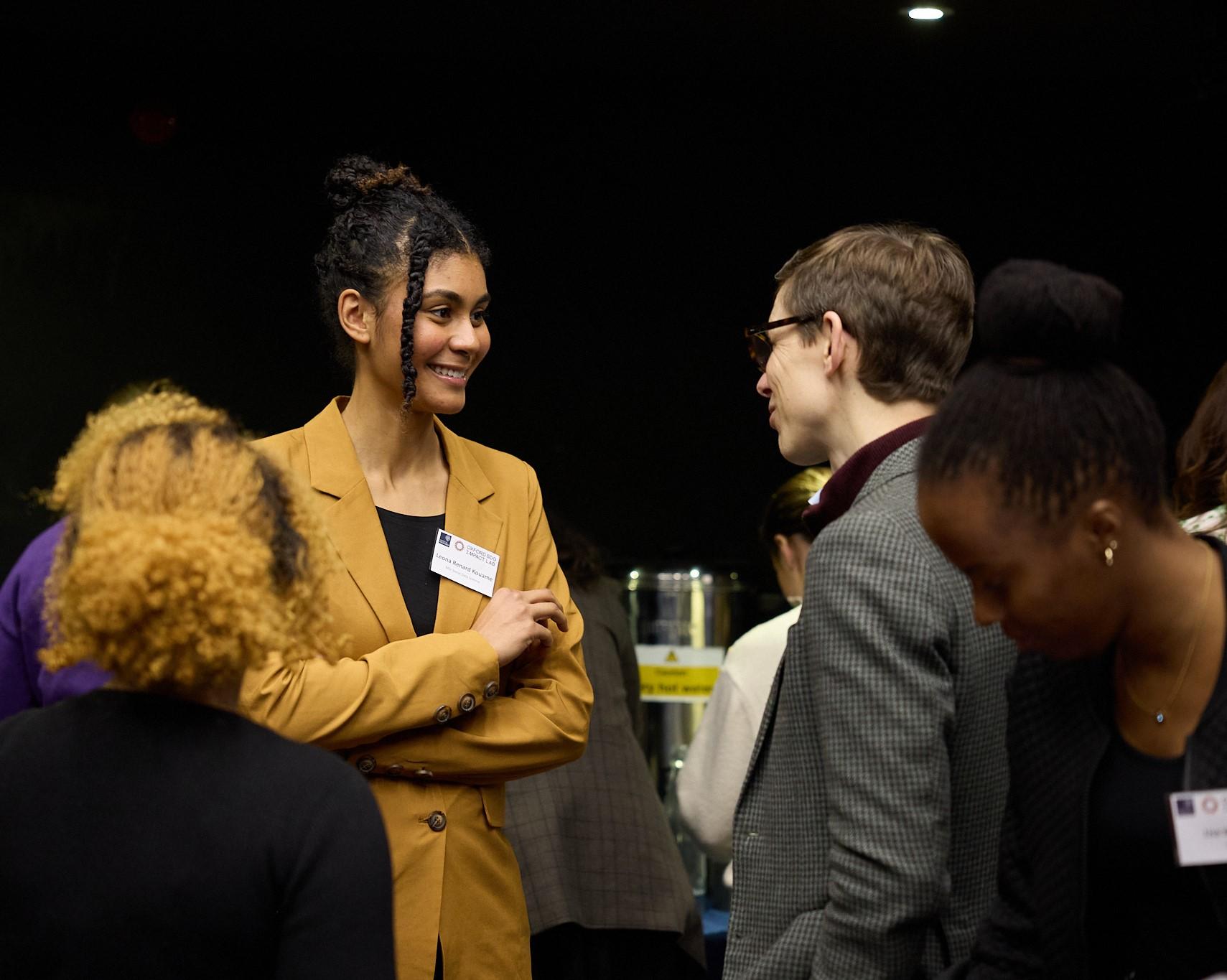 Leona Renard Kouame smiling in discussion with course director Dr Ed Brooks