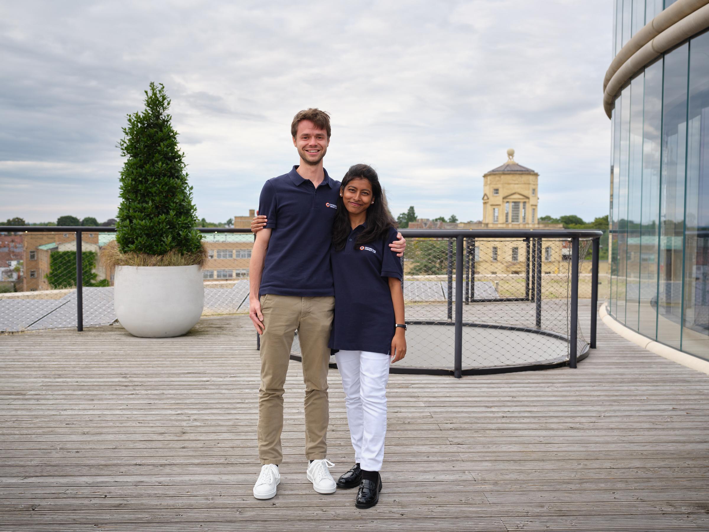 Aurona and Tilmann smiling on rooftop of the Blavatnik School